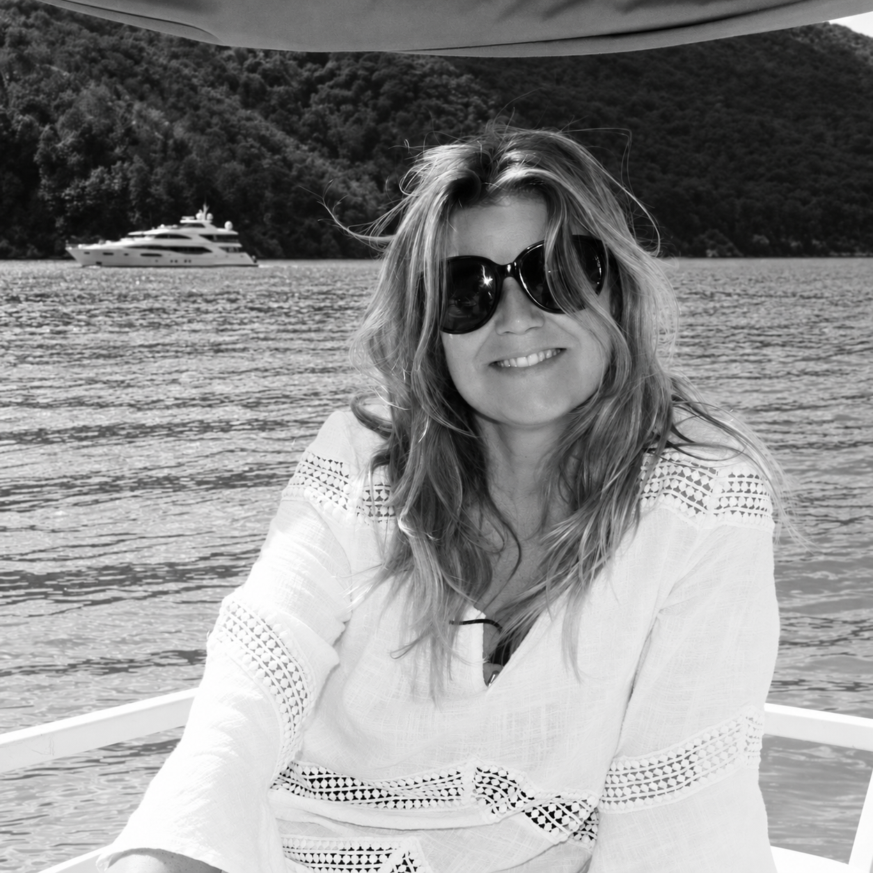 Christina, the Home or Away steward, aboard a boat on the lake